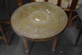 Round brass topped side table