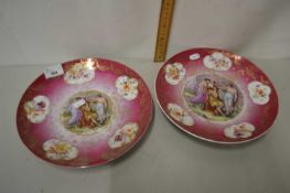 Pair of continental gilt finish plates with central panels of classical figures