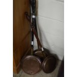 Three copper bed warming pans