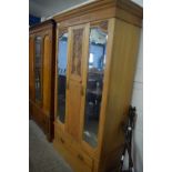 Late Victorian American walnut wardrobe with carved decoration and two mirrored doors, 112cm wide