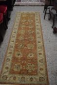 Modern beige and rust coloured runner carpet, 245cm long