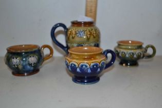 Four various small Doulton condiment pots