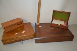 Two empty cutlery cases and two further small wooden boxes