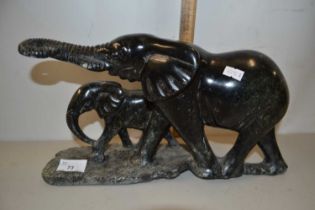 Polished stone model of two elephants