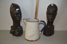 Pair of African wooden figures and an enamel jug