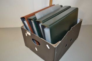 Four empty postcard albums