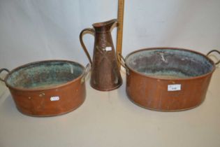 Copper jug and two oval copper pans