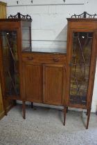 Edwardian mahogany drop centre display cabinet with central drawer and panelled doors, 140cm wide