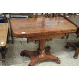 19th Century mahogany card table with folding top over a turned column and a platform base