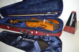 A modern Stentor Student II violin with case and accompanying metronome