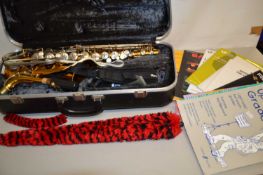 Conn 20M saxophone with case and various music books
