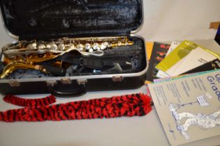 Conn 20M saxophone with case and various music books