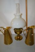 Brass based oil lamp and two brass snake skin effect jugs