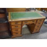 Late 19th Century oak and green leather inset twin pedestal desk, 122cm wide