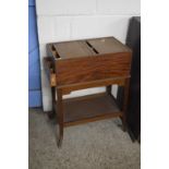 Finnigans, London a mahogany tambour top sewing cabinet with subdivided interior and two secret