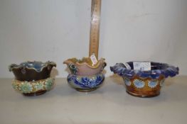 Four small Doulton vases with frilled rims