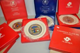 Collection of Hornsea Christmas plates with boxes