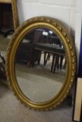 Early 20th Century oval bevelled wall mirror in gilt finish frame