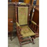 An American style late 19th Century rocking chair with floral upholstery