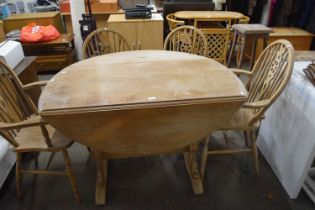 Folding oval table together with a set of four wheel back chairs