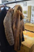 A brown fur stole, a brown fur shoulder cape and a pair of fur and leather gloves, (3)