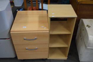 Light wood finish two drawer chest and a similar revolving bookcase (2)