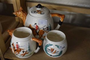 Three piece hunting interest tea set comprising teapot, milk jug and sugar bowl