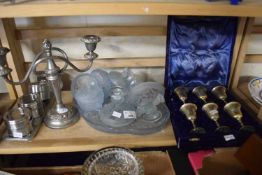 Mixed Lot: Silver plated candlestick, case of silver plated miniature goblets, glass dressing