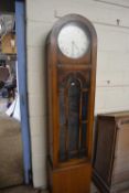 An early 20th Century long case clock with triple weight driven movement