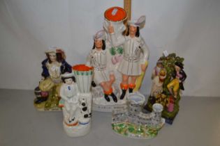 Collection of five various Staffordshire ornaments to include Robin Hood figure group and others