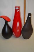 Group including a large red Art Glass vase and two contemporary pottery vases
