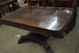 Georgian rosewood centre table raised on wide carved column and a platform base with paw feet, 137cm