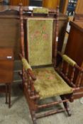 An American style late 19th Century rocking chair with floral upholstery