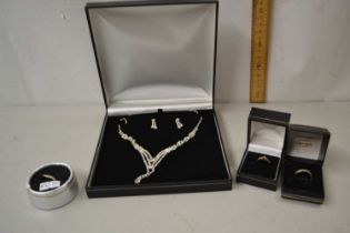 Three various small ladies 9ct gold and diamond set rings together with a further costume necklace