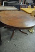 19th Century mahogany circular pedestal dining table raised on turned column with four outswept