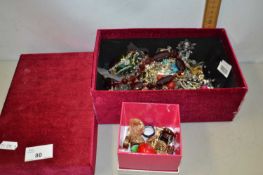 Red fabric covered box containing various assorted costume jewellery