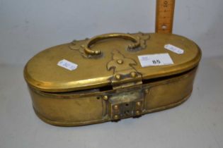 An oval hinged brass box containing various assorted costume jewellery, wristwatches and other