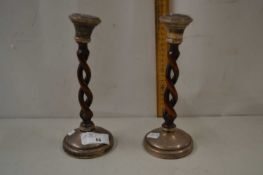 Pair of turned wooden and silver mounted barley twist candlesticks