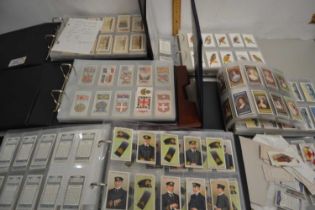 A collection of various cigarette cards in albums, principally John Player, Wills and others