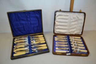 Two cases of fish cutlery