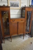 Edwardian mahogany drop centre display cabinet with central drawer and panelled doors, 140cm wide