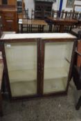 Top section of a bookcase cabinet with two glazed doors, 87cm wide, sold for repair