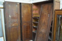 Two 19th Century mahogany single door cabinets, formerly part of a wardrobe together with a