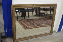 Rectangular bevelled wall mirror in foliate moulded gilt finish frame