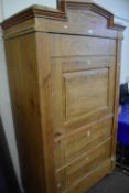 A pine faux drawer fronted wardrobe