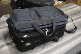 Marco Polo black suitcase and green holdall
