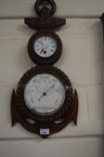 A novelty anchor shaped wooden mounted barometer and clock