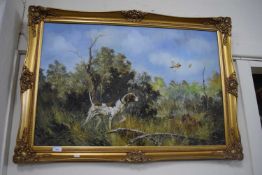 A spaniel amongst the grass by ? Hunting, oil on canvas in gilt frame