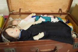 A suitcase and a quantity of assorted dolls