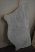 A marble shaped white marble dresser top